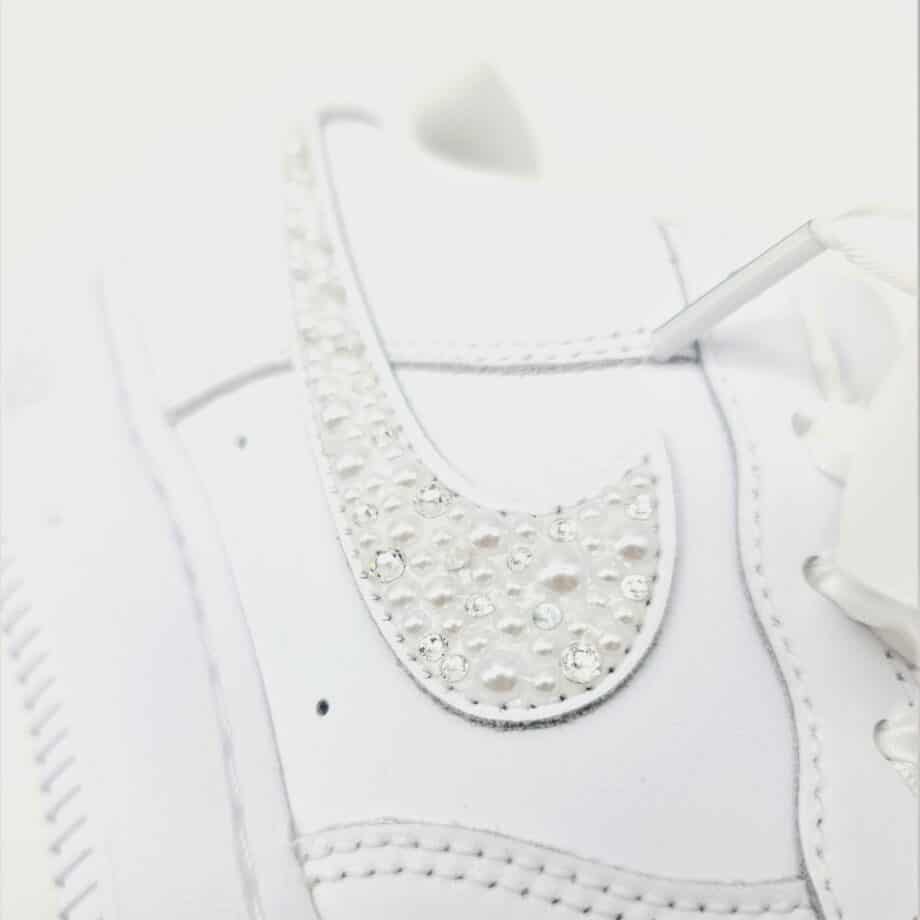 The Nike Air Force 1 Wedding Pearl, a pair of Nike Air Force 1s enhanced with a mix of pearls and Swarovski rhinestones.