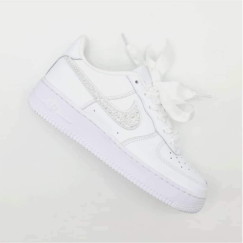 The Nike Air Force 1 Wedding Pearl, a pair of Nike Air Force 1s enhanced with a mix of pearls and Swarovski rhinestones.