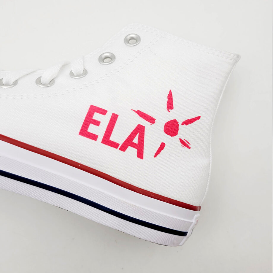 The ELA association logo on the side of the left Chuck Taylor Hi sneaker