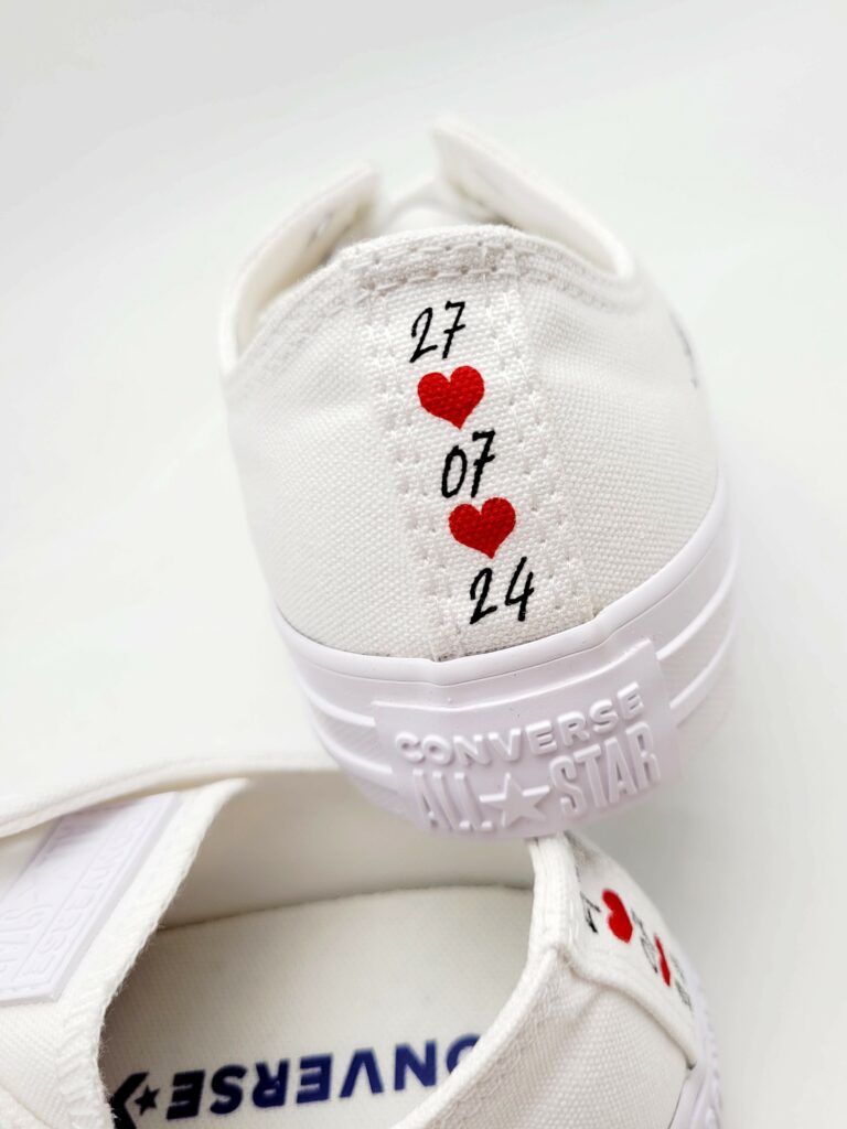 A personalization option with an inscription and motifs on the back of the wedding sneakers